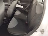 the interior of a car with two seats and a steering wheel