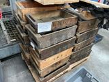 a stack of wooden crates sitting on top of a pallet