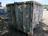 a dumpster sitting in the middle of a parking lot