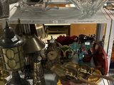 a shelf that has a lot of glass items on it