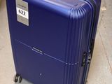 a blue suitcase that is sitting on the ground