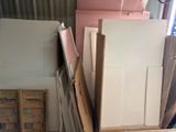 several pieces of cardboard are stacked up in a room