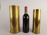 three bottles of wine sitting next to each other on a table