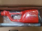 an image of a box with a red blow gun inside of it