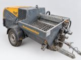 a close up of a trailer with a machine attached to it