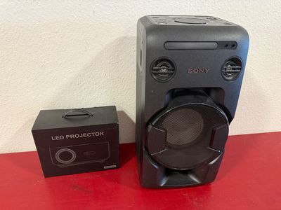 a close up of a speaker with a box on a table