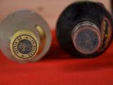 two bottles of wine that are sitting on a table