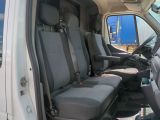 a white van with four seats in the back of it