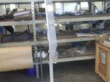 a large room with a lot of shelves and tables