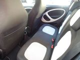 the interior of a car with two seats and a steering wheel