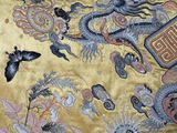 a painting on the wall of a building with a dragon on it