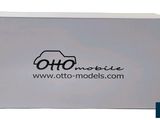 a white box with a black logo on the front of it