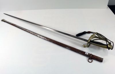 an old sword and other items on a white surface