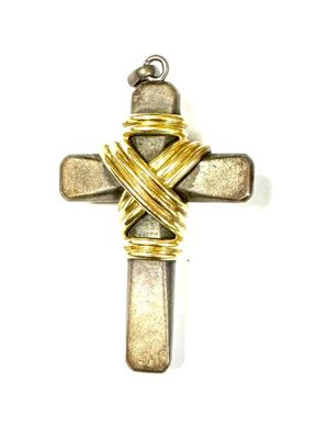 an image of a cross made out of gold and silver wire