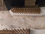 two wooden brushes that are sitting on the floor
