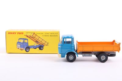 a toy truck with a box on the back of it