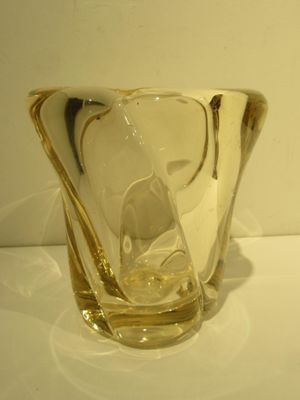 a glass vase that is sitting on a table