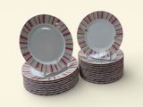 many plates stacked on top of each other on a table