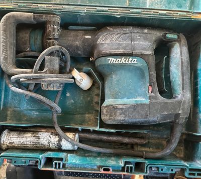 a blue box with a drill and a corded cord