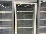 two refrigerators that are sitting in a store