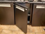 a picture of a kitchen with two refrigerators and a dishwasher