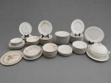 a lot of plates that are sitting on a table