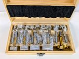 a wooden box with a bunch of screws inside of it