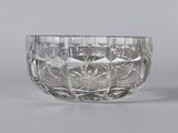 pair of cut glass bowls on a grey background