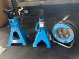 two blue jack stands sitting next to each other in a garage
