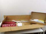 a box of books sitting on a desk next to a box of books