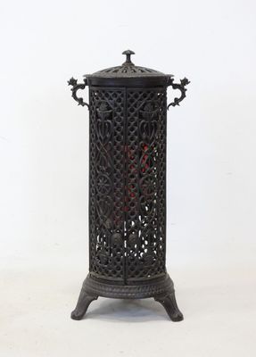 pair of antique cast iron candlesticks with ornate design