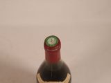 a bottle of wine that is sitting on a table