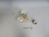 a spoon and a spoon rest on a white table