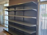 a empty shelf in the middle of an empty room