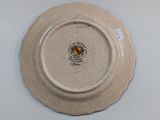 a white plate with a yellow and red design on it