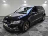 a black volkswagen polo estate parked on a checkered tile floor