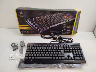 a computer keyboard and mouse sitting on a table