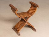 an image of a wooden chair on a beige background