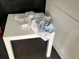 a white table with a towel on top of it