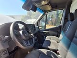 a view of the inside of a van from the driver ' s seat