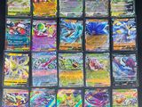 a bunch of pokemon cards sitting on top of a table