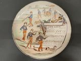 a plate that has a picture of a band playing on it