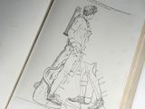 an open book with a drawing of a man on a skateboard