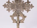 an image of a cross on a stand on a white background