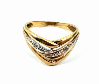 a close up of a gold and diamond ring on a white background