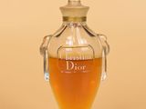 a glass bottle with a liquid inside of it