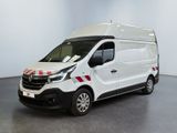 the white van is parked in a large room with a red and white stripe on the side of the van