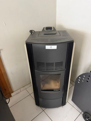 a small stove in the corner of a small room