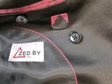 a close up of a zippered jacket with a label on it
