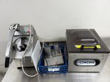 a machine that is sitting on a table next to another machine